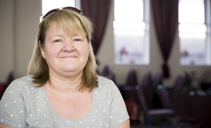 smiling client at foodbank centre